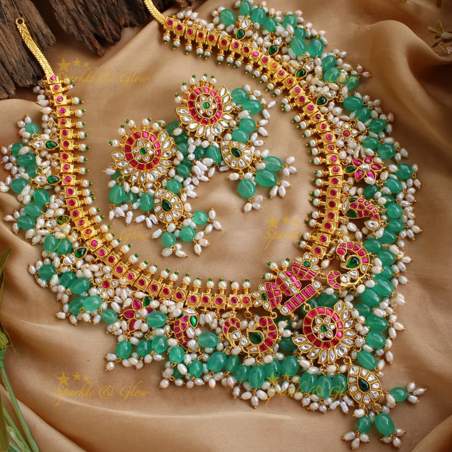 Exclusive grand Peacock and floral jadau long necklace with green beads and rice pearls - Sparkle and Glow