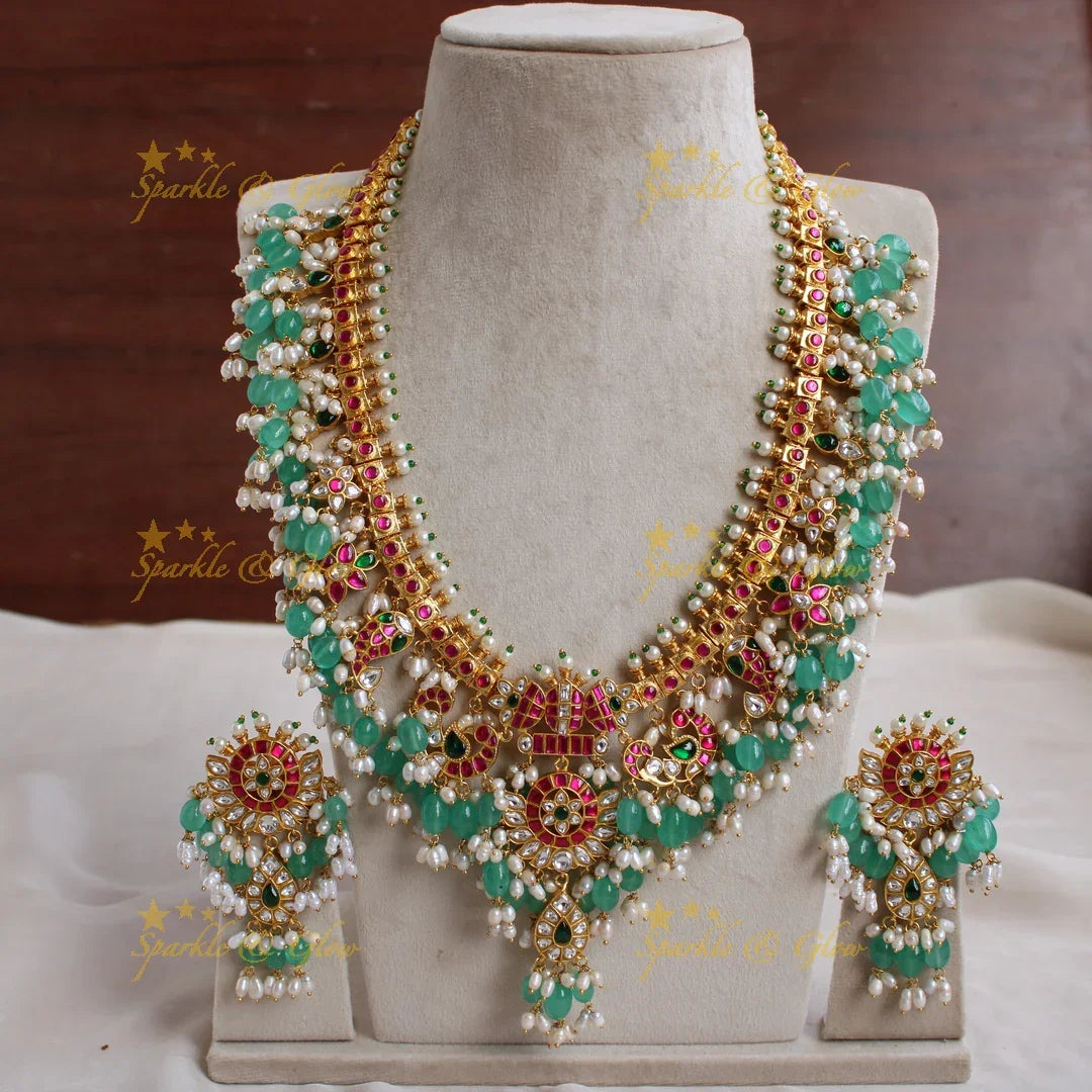 Exclusive grand Peacock and floral jadau long necklace with green beads and rice pearls - Sparkle and Glow