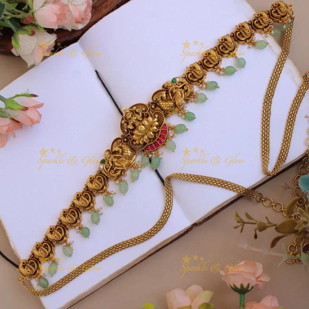 Elegant Lakshmi peacock carved jadau hipchain with pearls and mint green beads - Sparkle and Glow