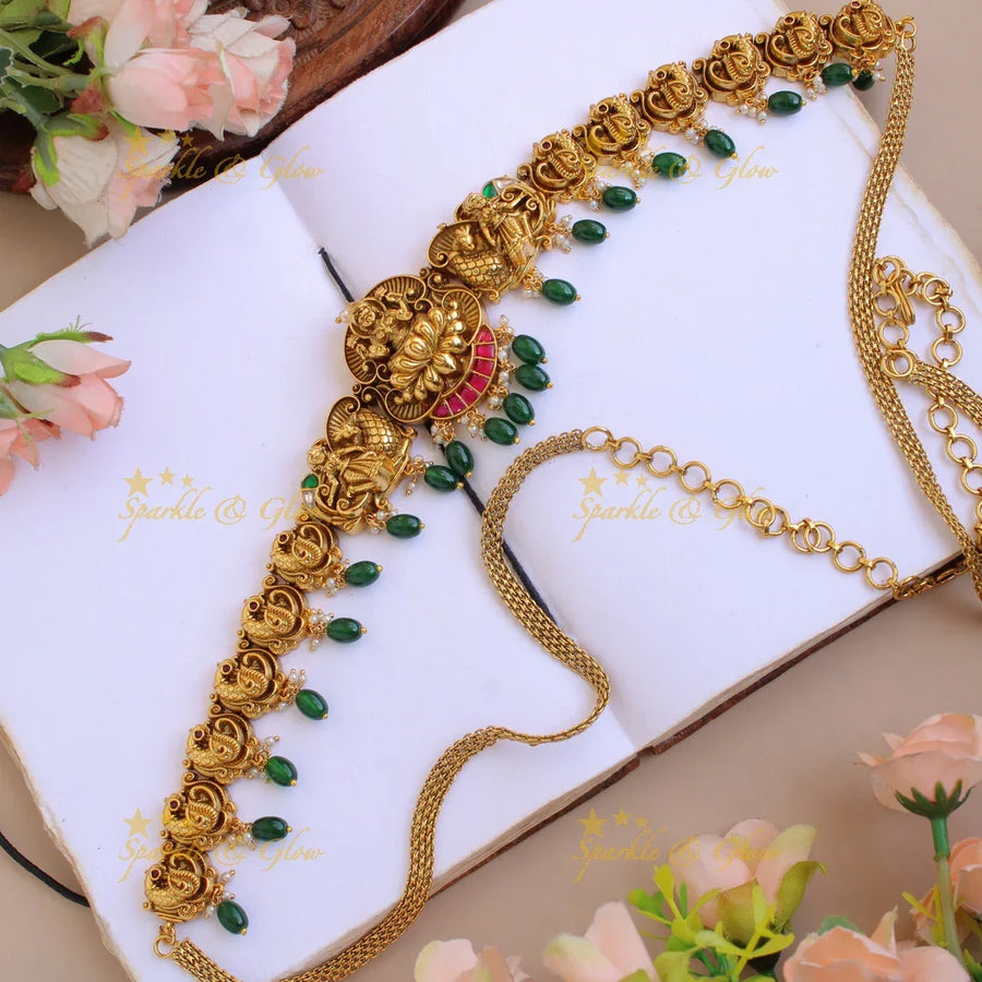 Elegant Lakshmi peacock carved jadau hipchain with pearls and mint green beads - Sparkle and Glow