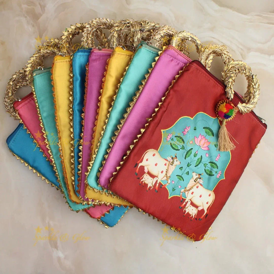 Beautiful cow printed potli bags - set of 10 - Assorted colours for return gifts - Sparkle and Glow