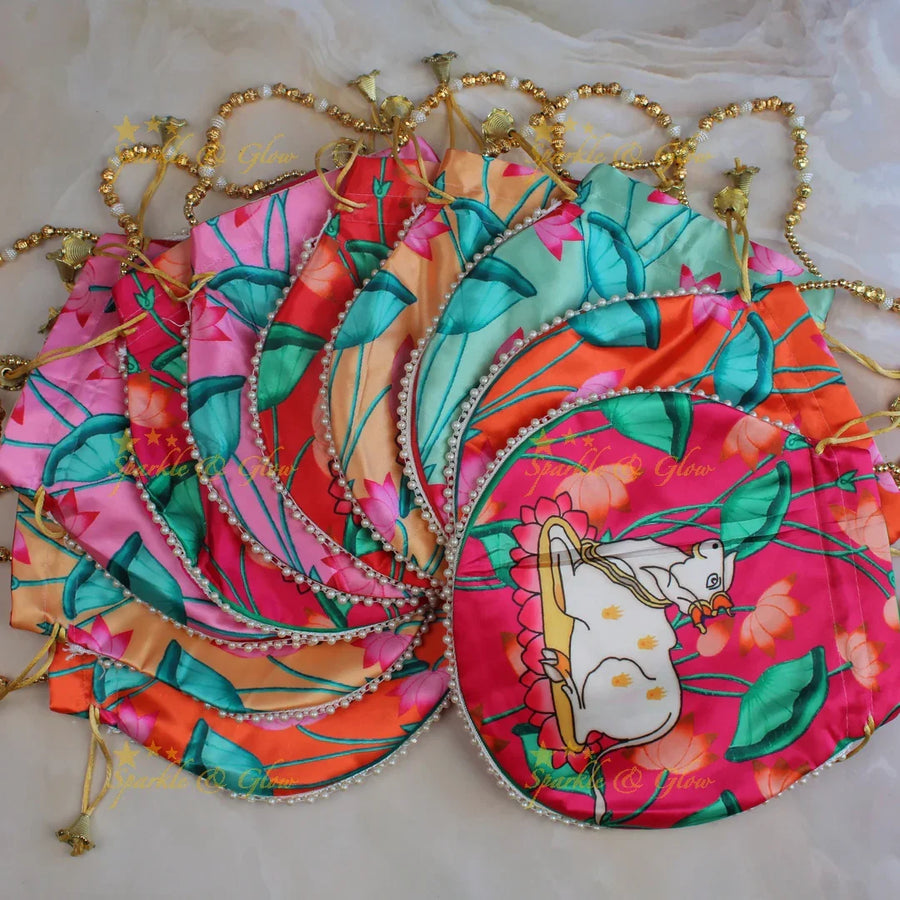 Pretty nandi print potli bags with gold beads - set of 10 - Assorted colours for return gifts - Sparkle and Glow