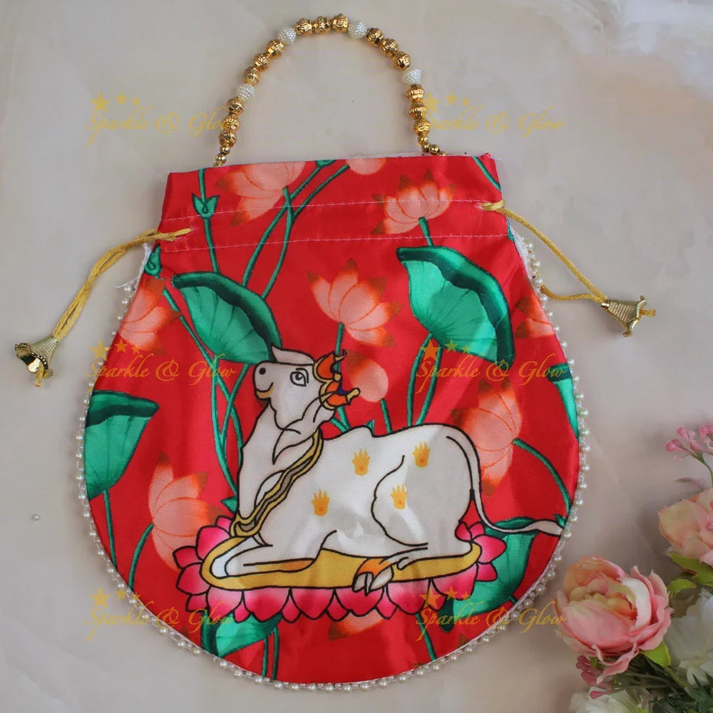 Pretty nandi print potli bags with gold beads - set of 10 - Assorted colours for return gifts - Sparkle and Glow