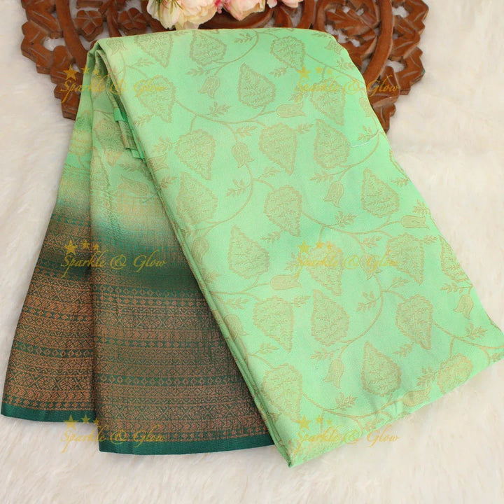 Pretty leaf printed light green with dark green border kubera pattu soft silk saree - Sparkle and Glow