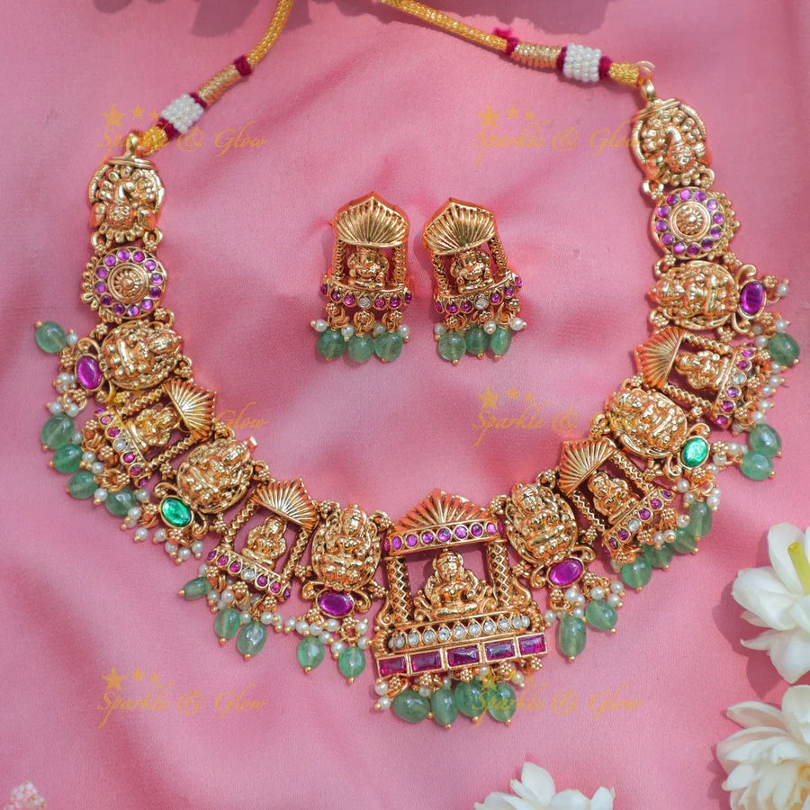 Stunning Antique gold alike Temple short necklace with Lakshmi Motifs and Green Beads - Sparkle and Glow