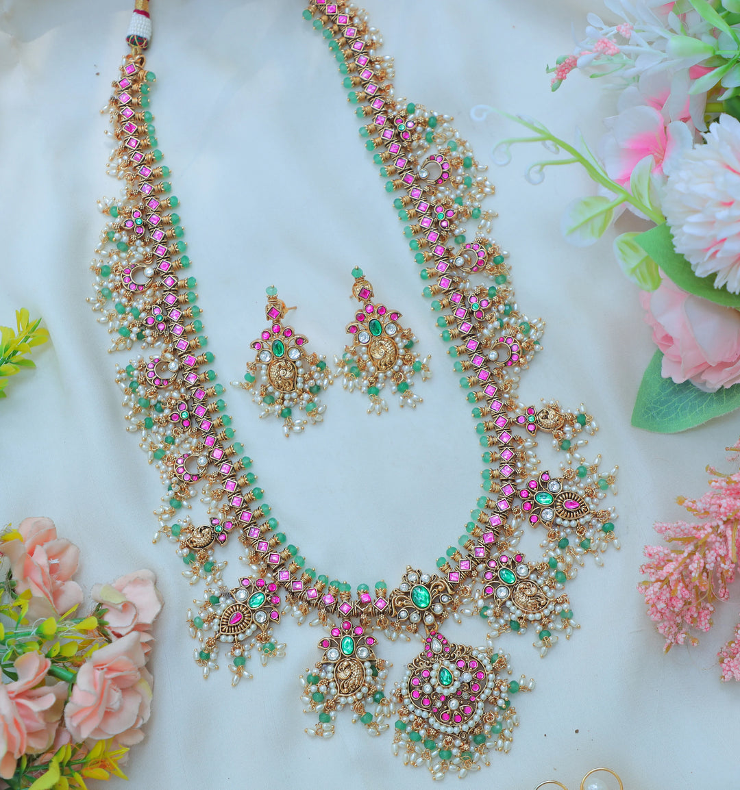 Gracious Jadau Kundan Antique Gold alike Lakshmi Necklace Set with Pink & Green Stone Embellishments - Sparkle and Glow