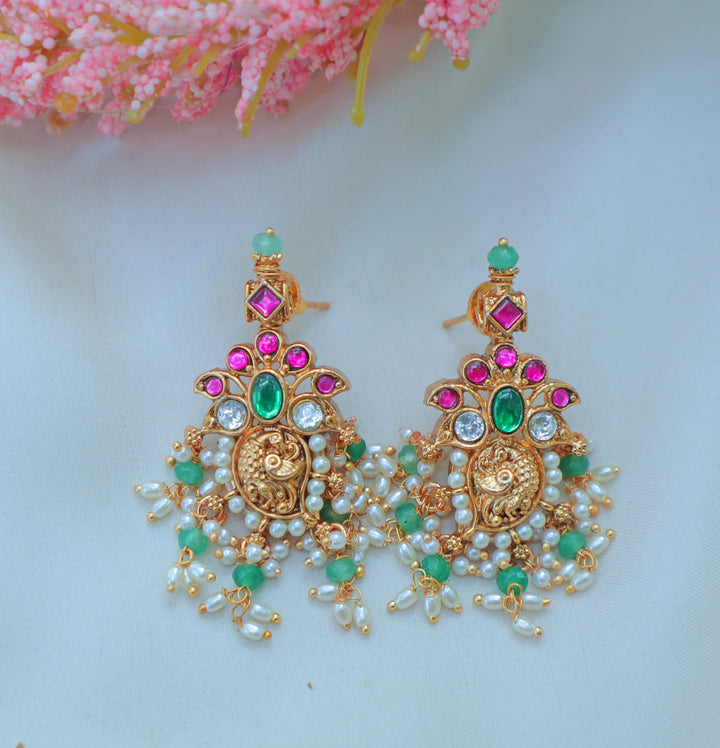 Gracious Jadau Kundan Antique Gold alike Lakshmi Necklace Set with Pink & Green Stone Embellishments - Sparkle and Glow
